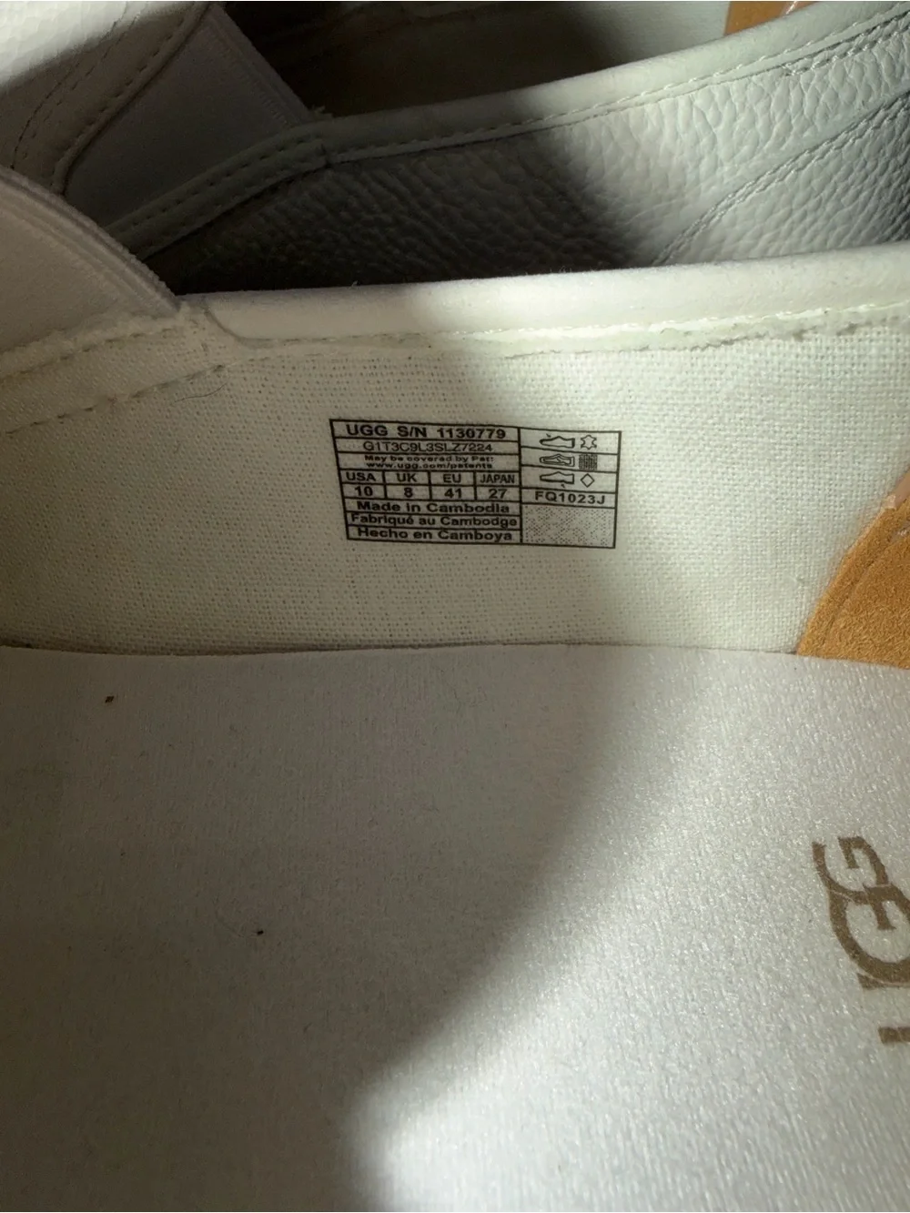 UGG Women's White Slip-On Leather Loafers with Tan Heel Tab